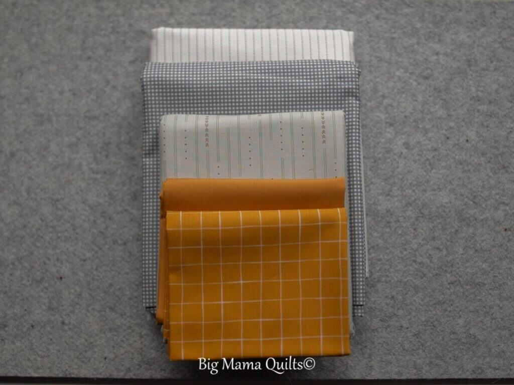 grey and gold fabric scraps