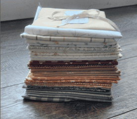 Fabric stacked in a bundle on the floor