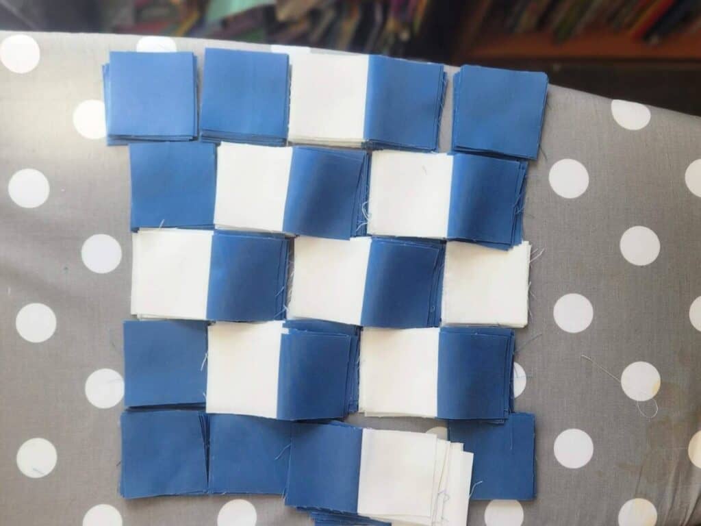 Blue and white squares ready to piece.