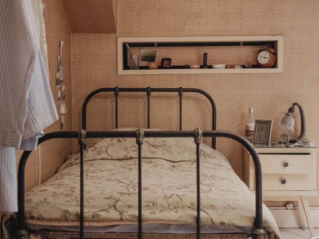 vintage wrought iron bed frame in a bedroom