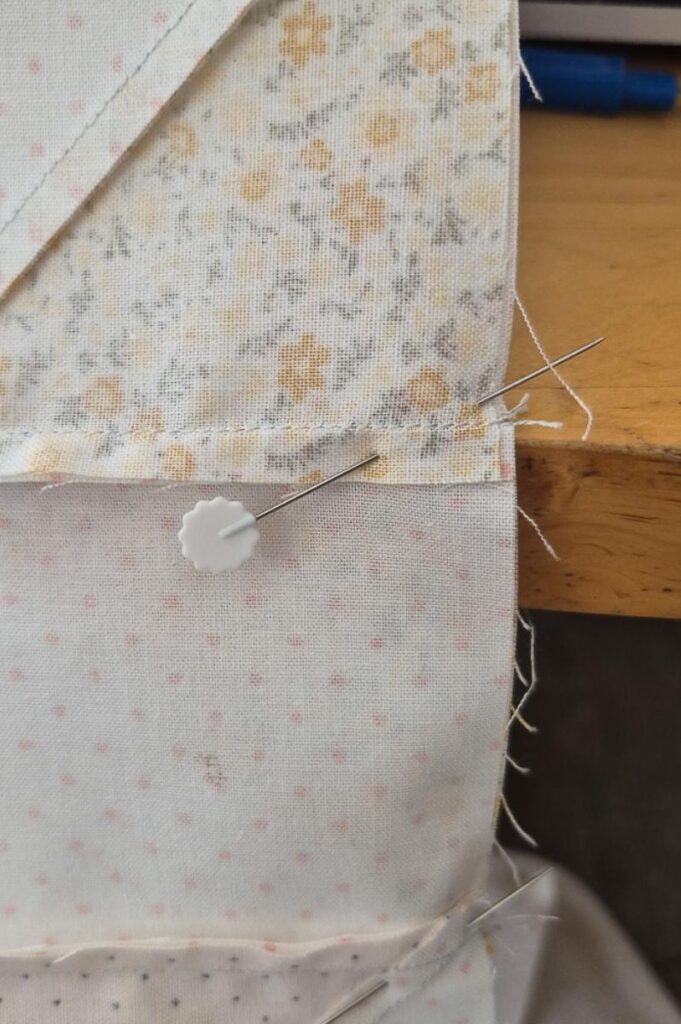 Benedict quilt two flying geese pinned together diagonally